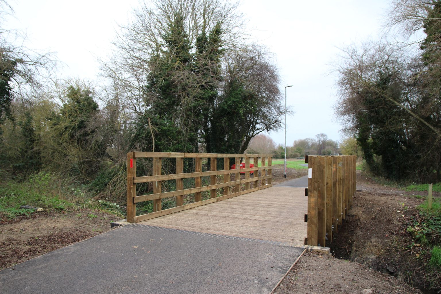 Wooden bridge across Coldham's Brook.
