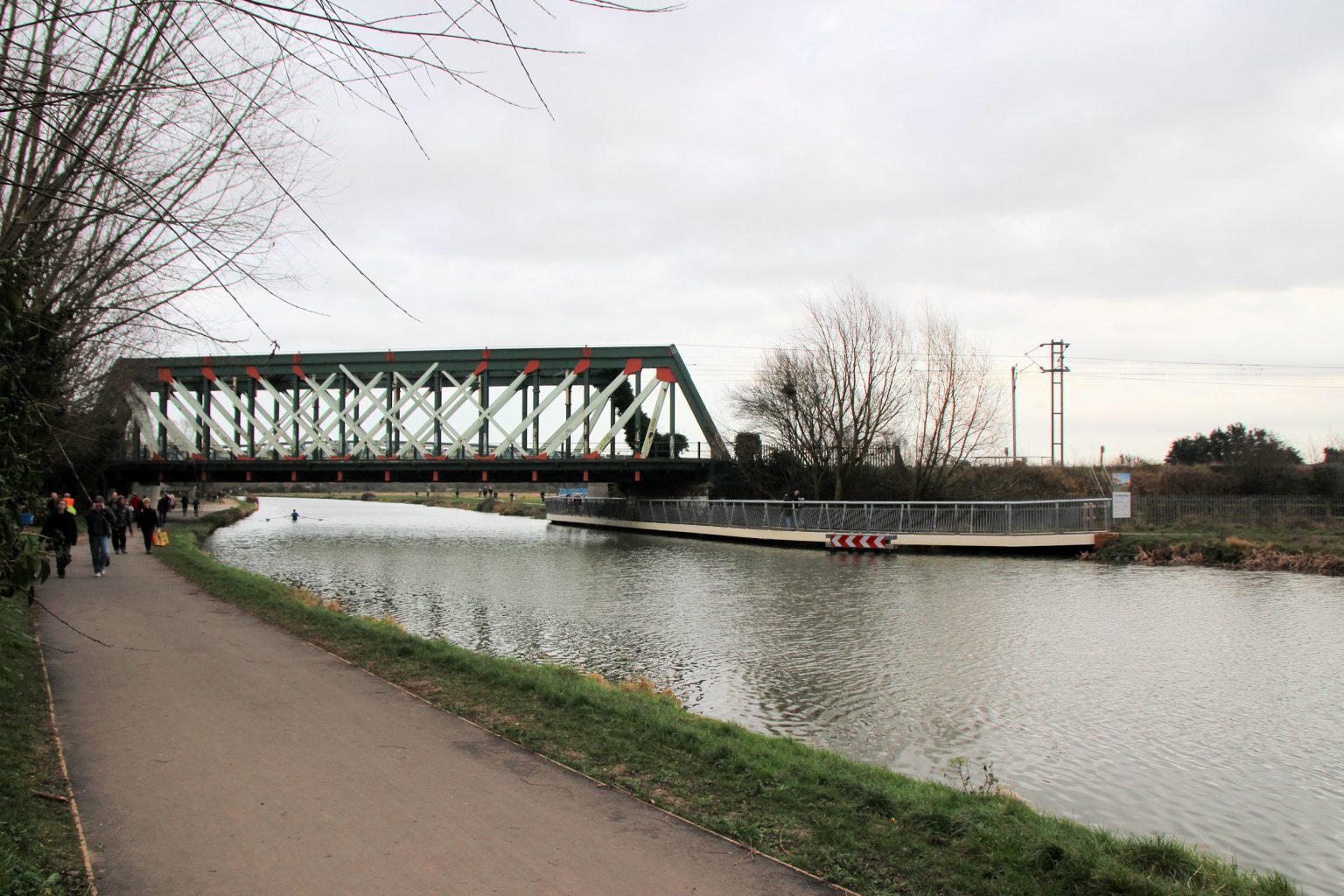 Railway bridge over River Cam, with foot/cycle bridge beyond