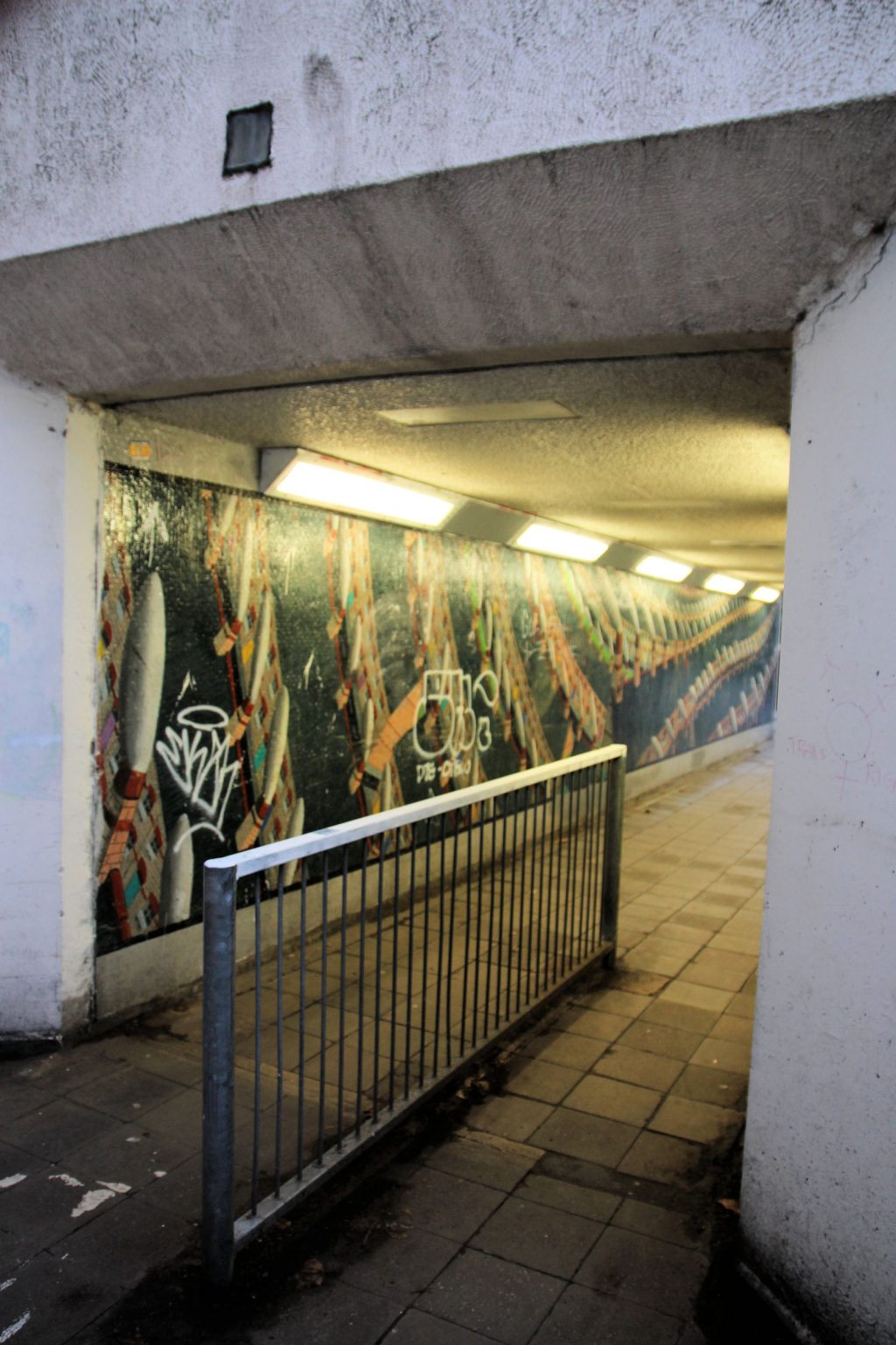 Terraced Houses mural with new graffiti